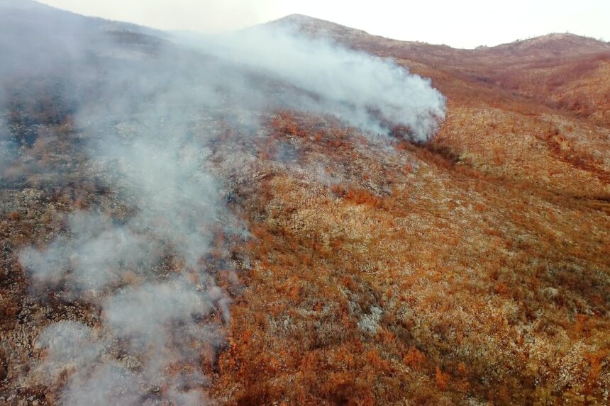 Drone aerial view of wildfire in the mountains