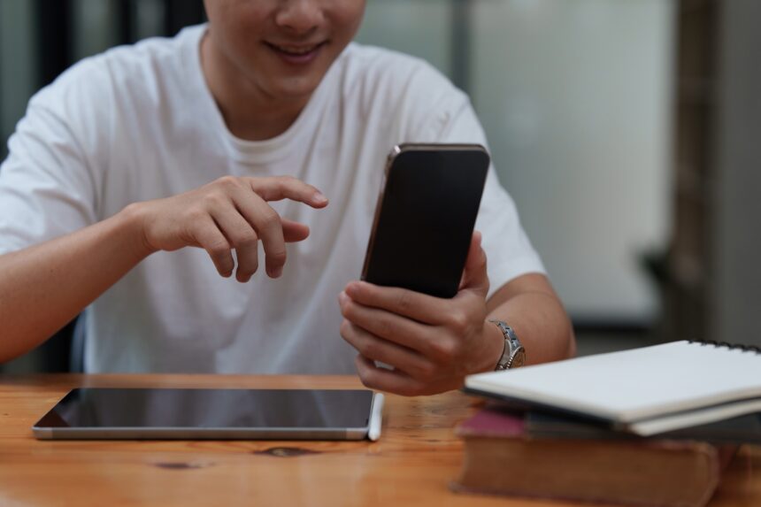 Man Completes KYC using an online banking app in order to open a digital savings account. The