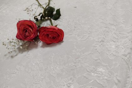 red roses on white floral textile