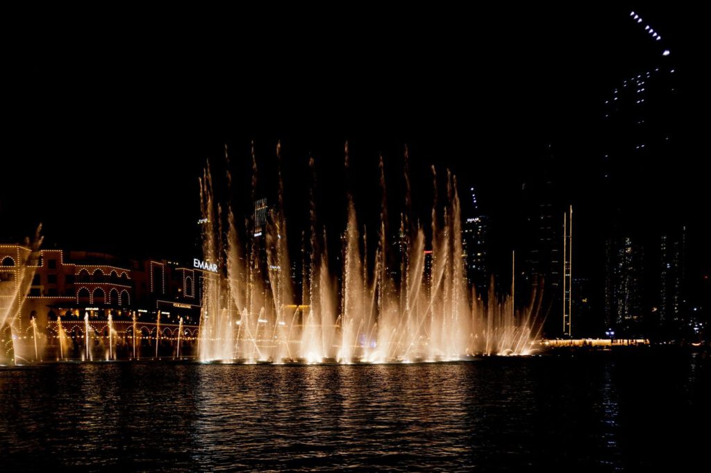 A captivating view of the Dubai Fountain beautifully illuminated against the night sky.