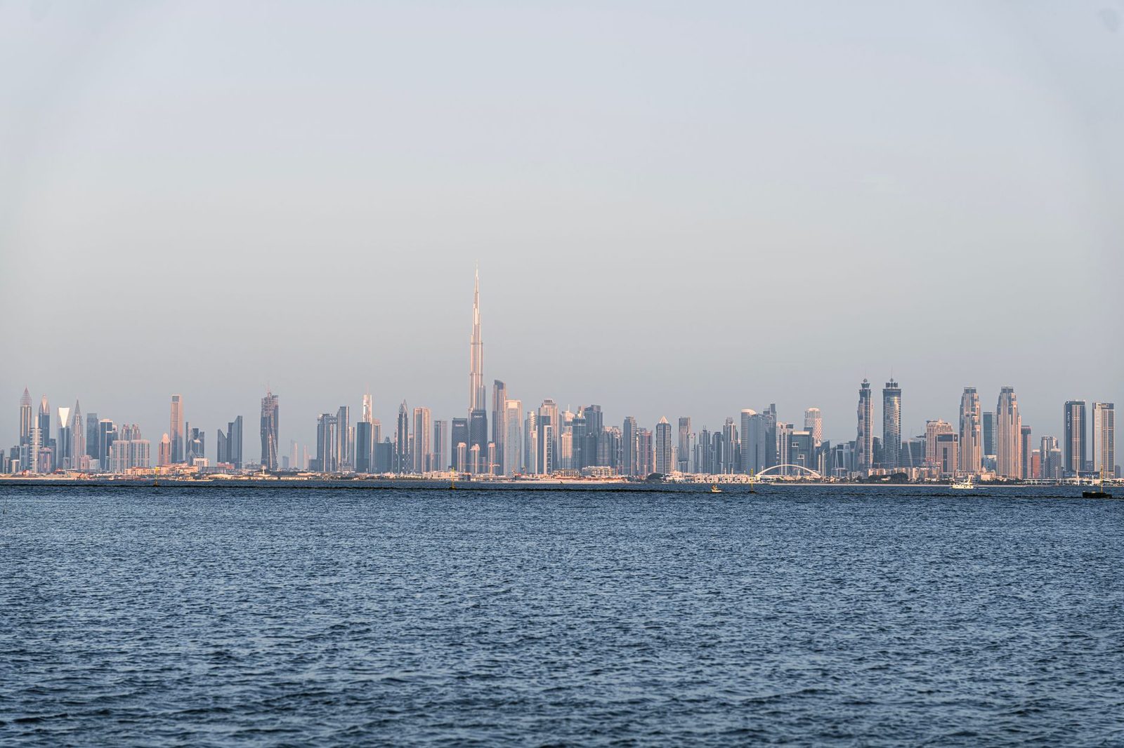 A stunning view of Dubai's skyline featuring Burj Khalifa across the sea.
