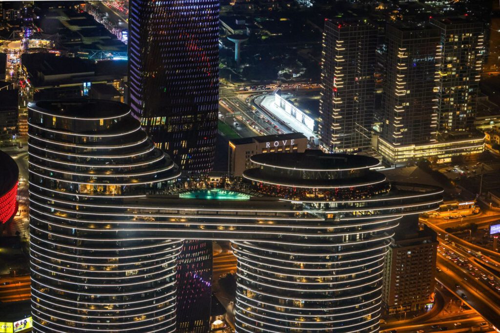 A breathtaking aerial view of a vibrant city skyline illuminated at night.