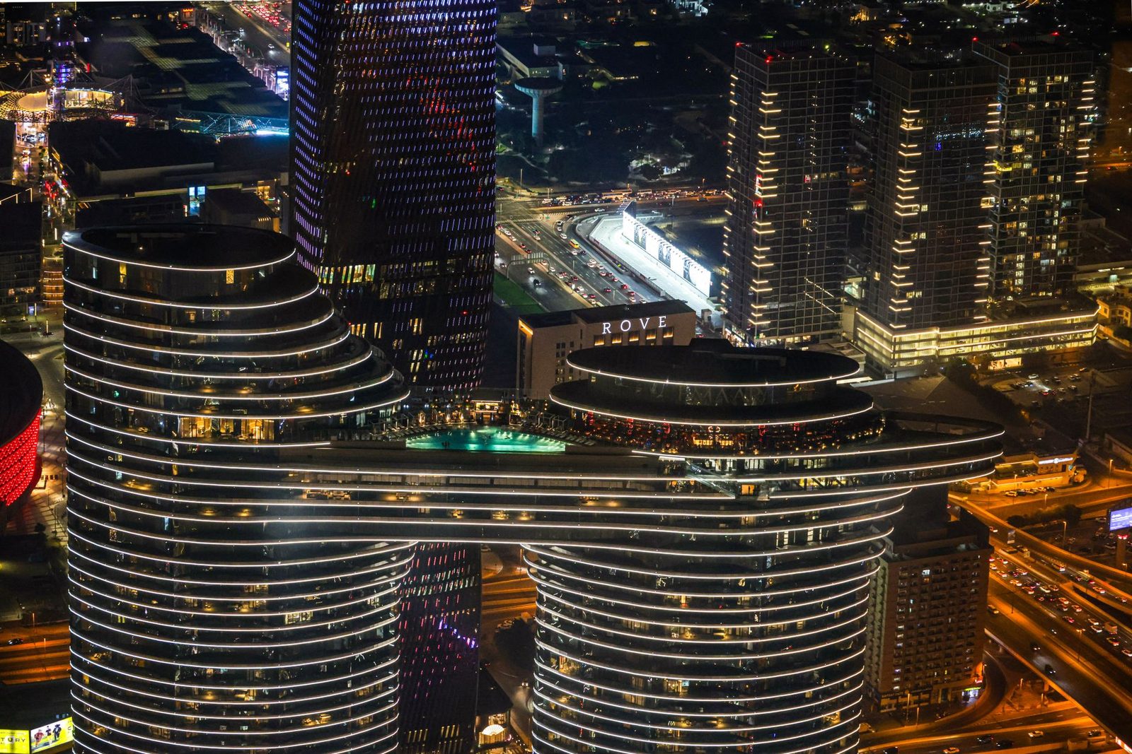 A breathtaking aerial view of a vibrant city skyline illuminated at night.