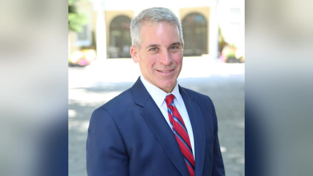 Atlanta criminal defence lawyer Brian Steel in a navy suit and red tie
