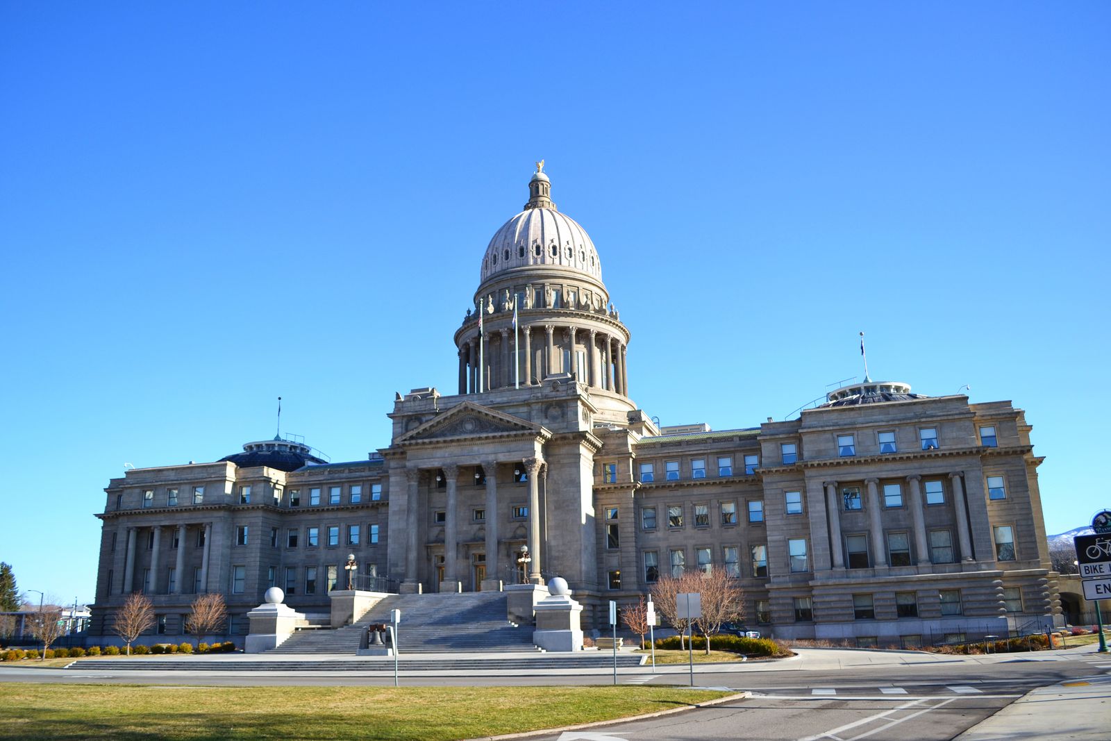 Idaho State Capitol in Boise with its white dome and columned facade under a clear blue sky