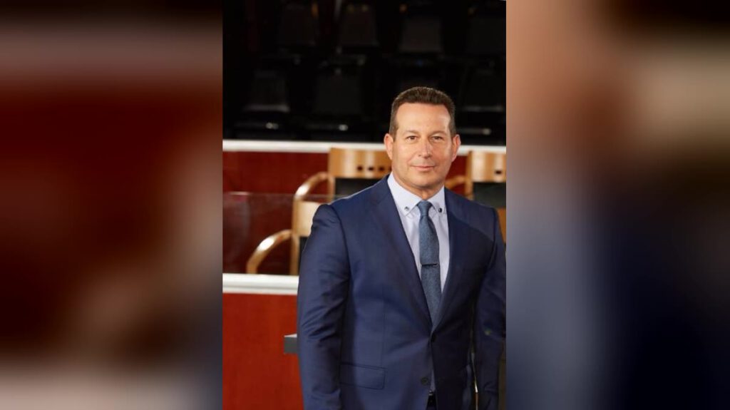 Criminal defence lawyer Jose Baez in a navy suit standing in a courtroom