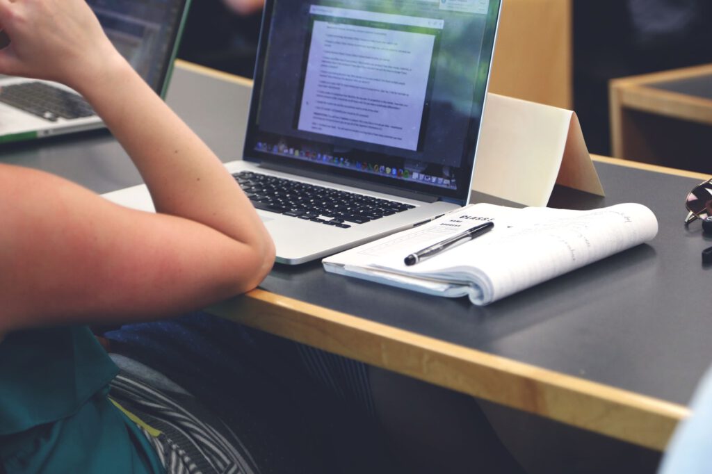 Adult learner taking an online paralegal certificate class on a laptop