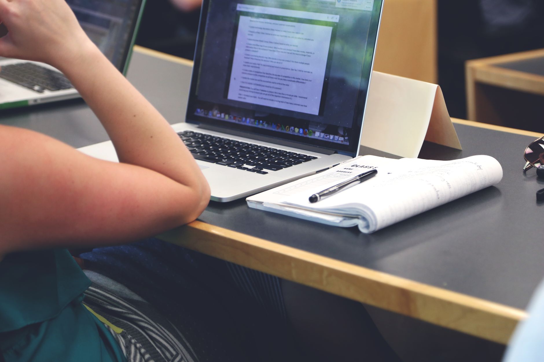 Adult learner taking an online paralegal certificate class on a laptop