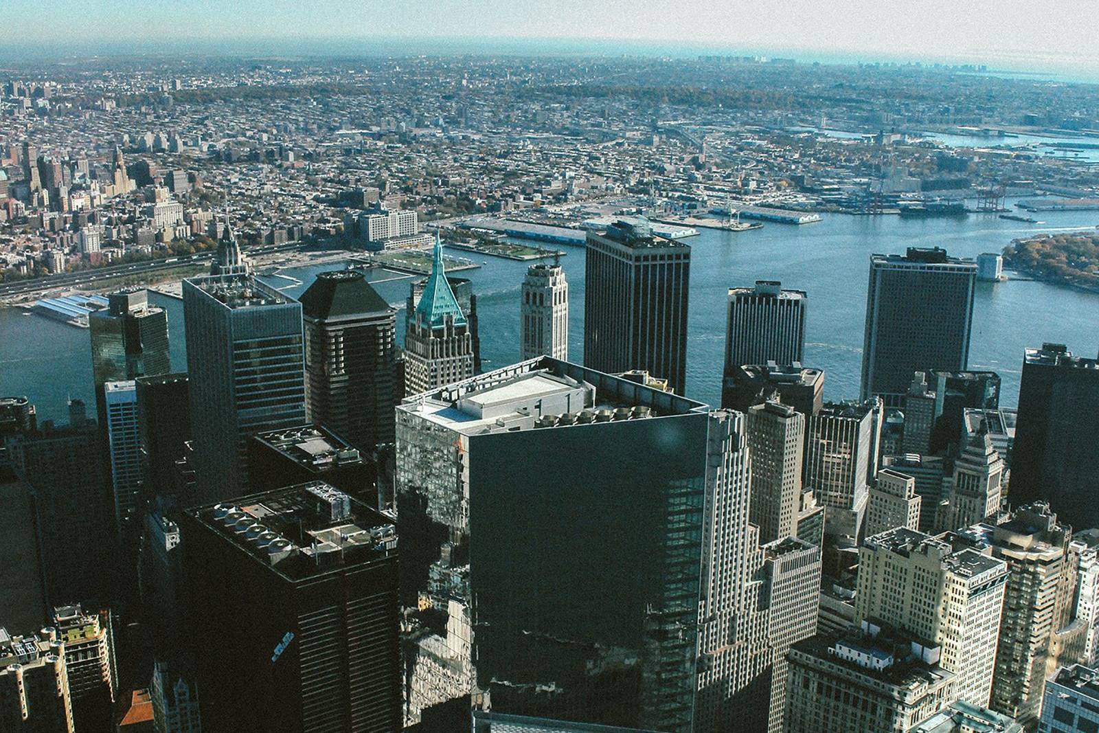 Aerial view of Lower Manhattan office towers and the East River, home to many large law firms