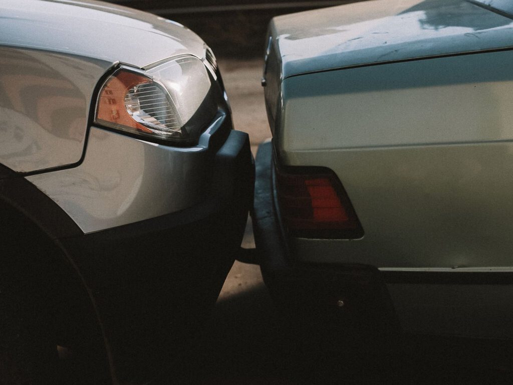Close-up of two cars after a minor rear-end collision, an everyday example of a negligence tort