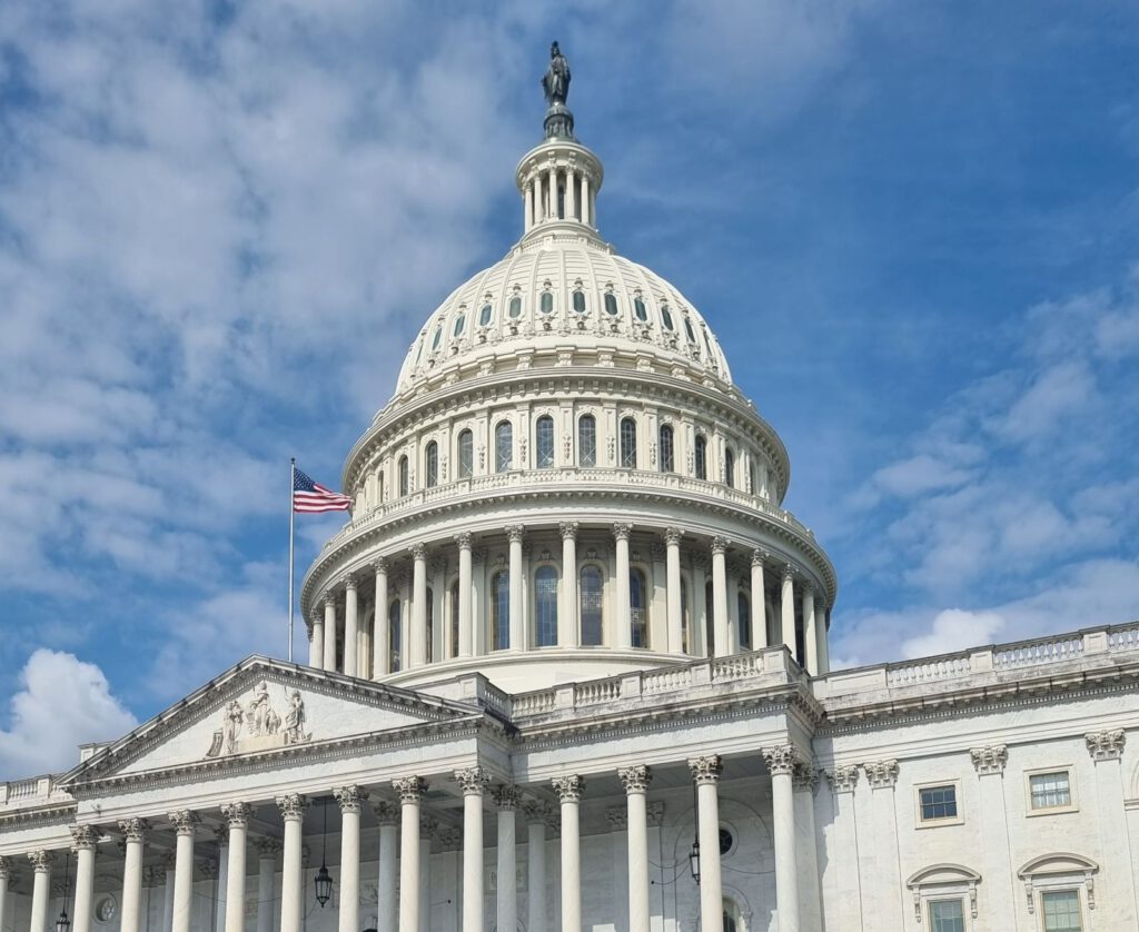 Dome of the US Capitol in Washington, DC, the centre of federal lobbying, with the US flag flying